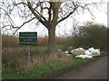 Fly-tipping and the entrance to Ninescores Farm