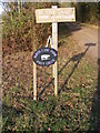 TM2575 : North Lane Farm & Cottage signs by Geographer