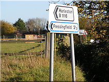TM2773 : Roadsign at the B1116 junction by Geographer