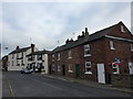 The Angel and brick built cottages