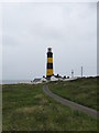J5233 : The Point Road near St John's Point Lighthouse by Eric Jones