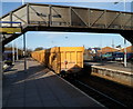 Freight train speeds through Trowbridge railway station