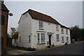 A pair of weatherboarded cottages.