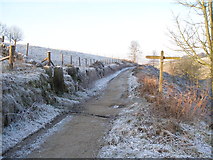 SD9628 : The Pennine Way crosses Hudson Mill Road by John Slater