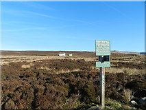 SK0588 : Signpost and shooting cabin by Peter Barr