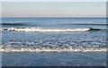 NZ8812 : Breaking wave, Upgang Beach by Pauline E