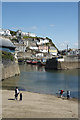 Skimming under the Inner Harbour Wall Mevagissey