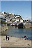 SX0144 : Skimming under the Inner Harbour Wall Mevagissey by Peter Skynner