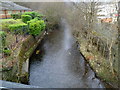 Rhondda Fawr river flows towards a road bridge near the A4061, Ynyswen