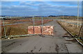 Slab of rock and fencing blocks road at the western edge of Glan Llyn