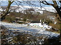 Isolated cottage below Ffrith Mountain in winter