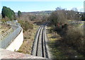 Single-track railway line heads ESE away from Penallta Road, Tredomen