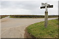 Crossroads with old signpost