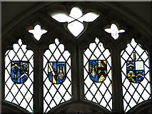 TM3761 : St Mary's church in Benhall - heraldic panels in east window by Evelyn Simak