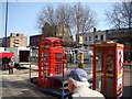 Red telephone boxes on Whitechapel Road