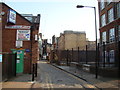 TQ3481 : View of the arch leading from Gunthorpe Street onto Whitechapel High Street by Robert Lamb