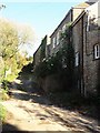 Buildings alongside a green lane at Woolston