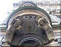 Male caryatids on the Merchants