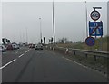 SJ3799 : End of motorway M57, Switch Island by Peter Whatley