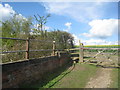 Stile at the end of the railway bridge