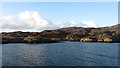 NF9467 : Shore of Loch Maddy by Richard Webb