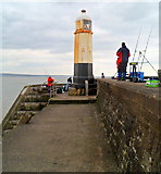 SS8276 : Fishing near Porthcawl Breakwater Lighthouse by Jaggery