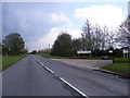 TM3054 : B1438 Yarmouth Road & the entrance to John Woods Nurseries by Geographer