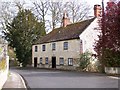 Old stone houses opposite the church, Codford St Peter