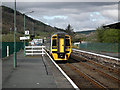 A Pwllheli bound train departing from Porthmadog