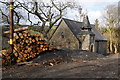 Pile of logs by St Matthew