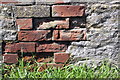 Old benchmark on building at Manor Farm