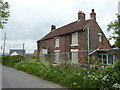 Old house, boarded up, for sale