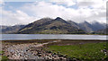 NG9219 : Stream reaching the shore of Loch Duich by Trevor Littlewood