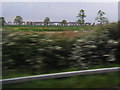 View west from M1 northbound near New Covert with new housing beyond