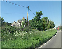 TQ8816 : A259 passes St Nicholas Church by Stuart Logan