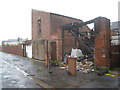 Burnt-out outbuildings in the ten foot behind Smith Street