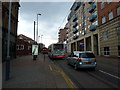 Two buses and a car in West Street