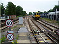 Two trains leaving Sutton station