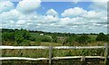 Wooden fence and farms beyond, Battle