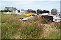 Beach huts and boats behind Kingsdown Beach