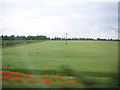 TL3240 : Fields and shelter-belts around Highfield Farm, from the train by Christopher Hilton