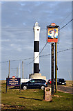 TR0916 : Dungeness delights: The new lighthouse, The Britannia Inn sign, the car park and the litter bin! by Brian Chadwick