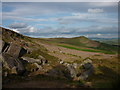SD9955 : Gritstone boulders on Embsay Moor by Karl and Ali