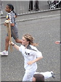 SZ0894 : Ensbury Park: the Olympic torch goes past by Chris Downer