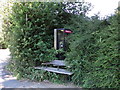 Slightly overgrown bench and telephone box, Gallows Hill / Abbots Road, WD4