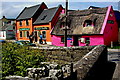 R0796 : Doolin - Fisherstreet (R479) - Three Shops (2 Orange, 1 Pink) & Bridge by Joseph Mischyshyn
