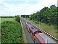 Empty freight train heading north on the West Coast Main Line