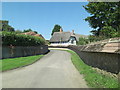 Stone Lane passes Church Farm Cottages