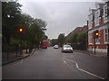 TQ2482 : Harrow Road by Queens Park library by David Howard