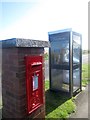 NU1934 : Post box and phone box, Links Road, Bamburgh by Graham Robson